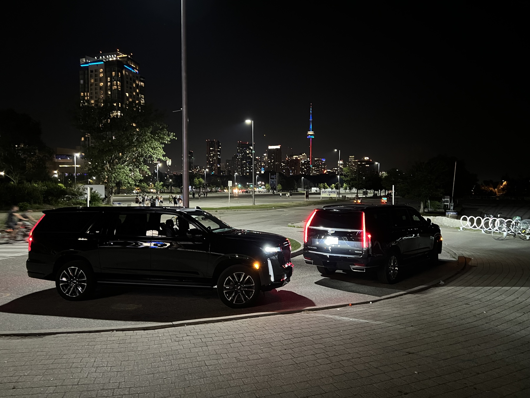 Flex Escalades with the Toronto skyline after dark